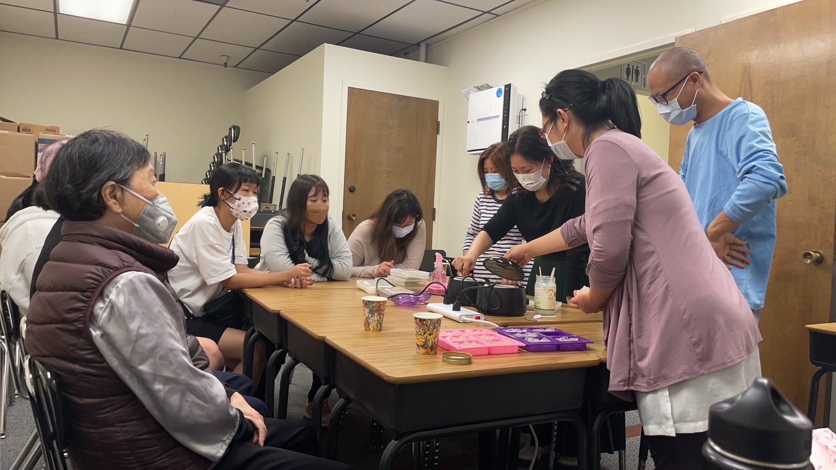 Participants sharing a practical learning demonstration at WUC